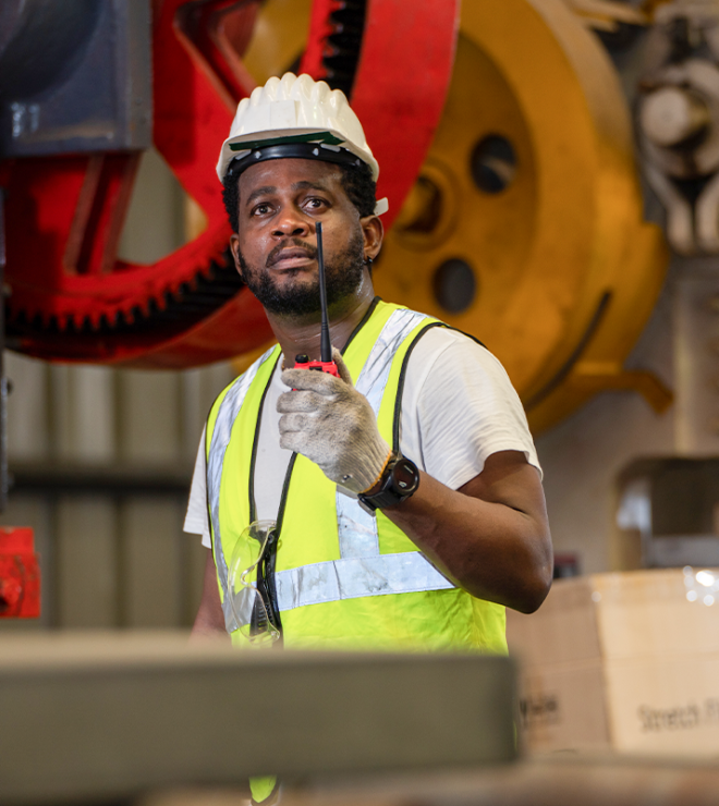 Industrial worker with machinery - Machinery Breakdown Insurance