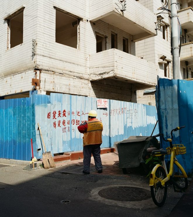 Worker in a hard hat at a construction site - Workers Compensation